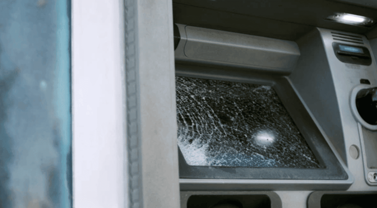 smashed and broken ATM machine